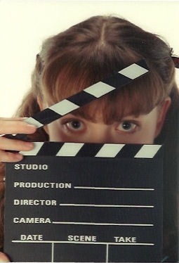 Lacy with a clapboard